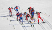 Athletes compete in the men's team sprint event.